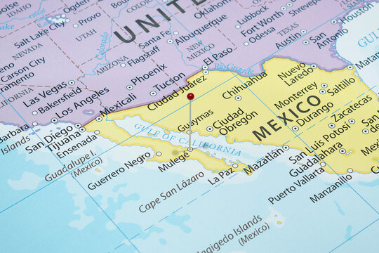 Close up to a Mulege city with a red pin needle into Mexico country political map 
