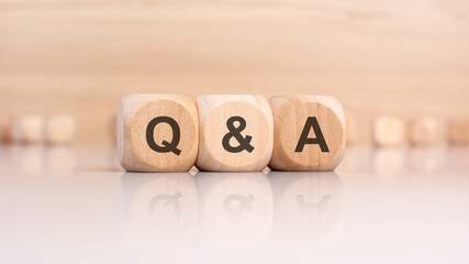 wooden cubes with letters Q and A. q and a - short for Question and Answer