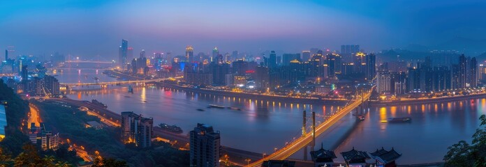 Naklejka premium Cityscape at Dusk with River and Bridge