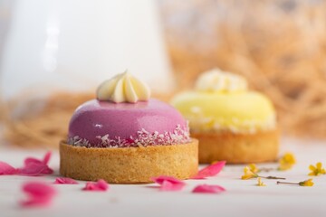 Cute sweet delicious cupcake on desk on pastel background
