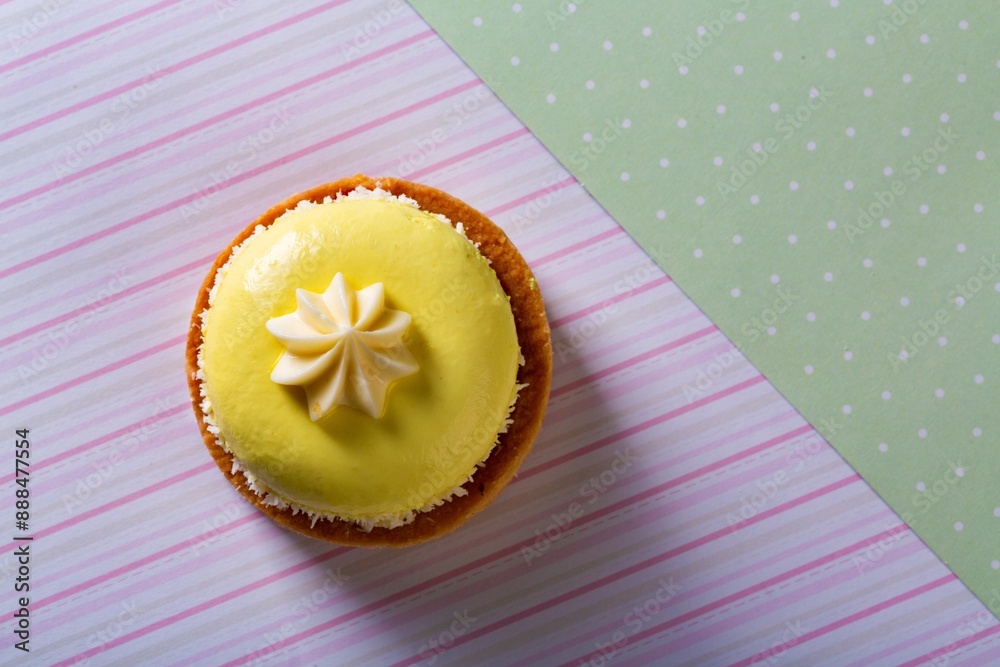 Sticker Cute sweet delicious cupcake on desk on pastel background