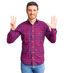 Handsome young man with bear wearing casual shirt showing and pointing up with fingers number eight while smiling confident and happy.