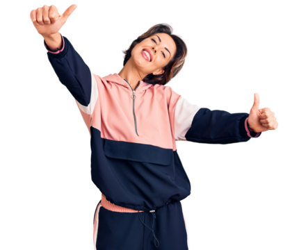 Young beautiful woman wearing sportswear approving doing positive gesture with hand, thumbs up smiling and happy for success. winner gesture. - Powered by Adobe