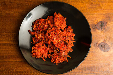 Fried onion fritters on a plate