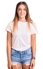 Obraz premium Beautiful caucasian woman wearing casual white tshirt with a happy and cool smile on face. lucky person.