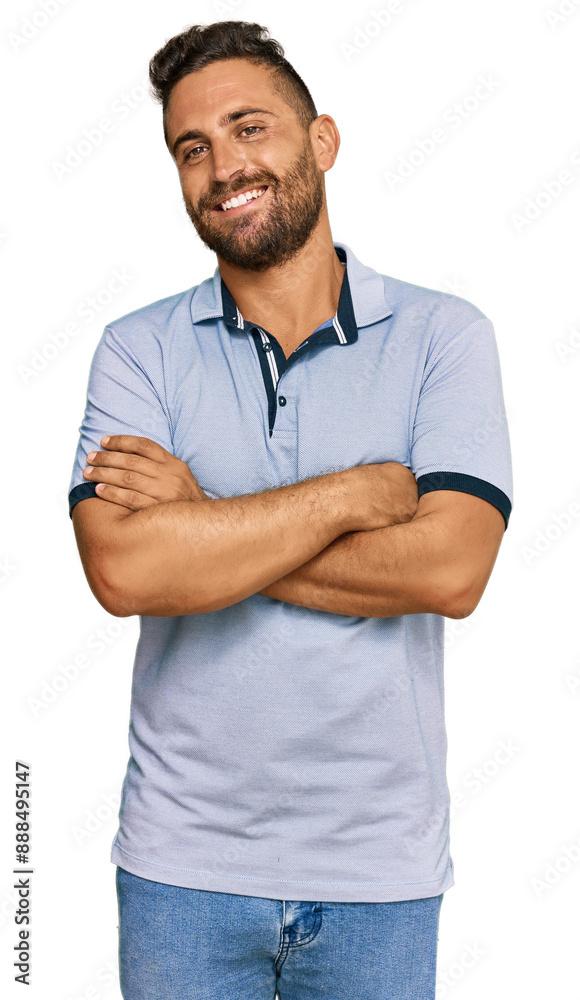 Poster handsome man with beard wearing casual clothes happy face smiling with crossed arms looking at the c