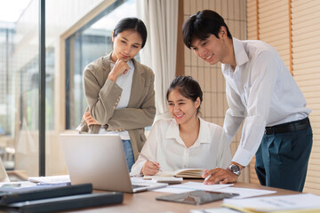 Fototapeta premium Business Team Collaborating and Sharing Ideas in a Modern Office Environment