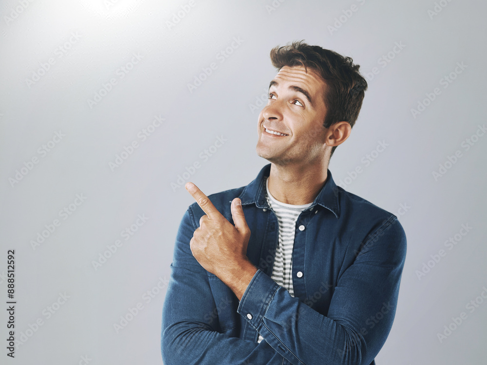 Poster man, studio and pointing at mockup for choice, opinion and idea on gray background. male designer, d