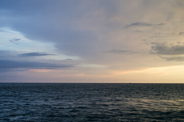Sun setting over the Gulf of Mexico from the point of view of a viewer on a boat. 