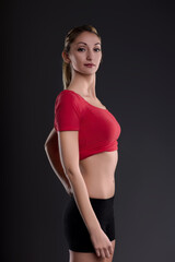 Young athletic woman posing showing her fit body after dieting