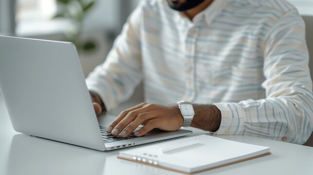 Hands of a business professional using a laptop and a notebook, showcasing multitasking and efficient time management. Height Resolution Photo, , Minimalism,