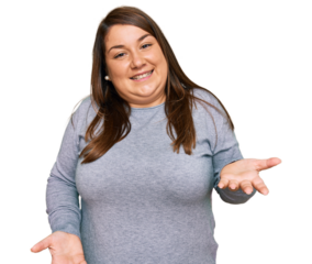 Beautiful brunette plus size woman wearing casual clothes smiling cheerful with open arms as friendly welcome, positive and confident greetings