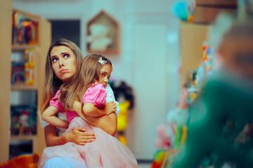 Mom Hugging her Daughter in a Store Calming her after a Tantrum. Mother feeling empathy in shooting her child in a toy shop
