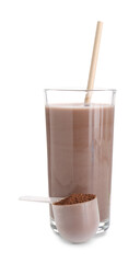 Delicious protein shake in glass and scoop with powder isolated on white