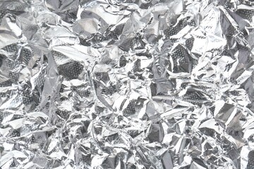 Shiny silver tinfoil surface as background, closeup