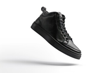 Flying black sneaker isolated on white background. Fashionable stylish sports casual shoes. Creative minimalistic footwear