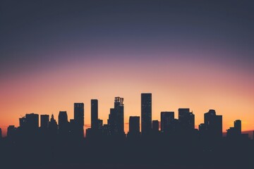 Fototapeta premium Subdued city skyline silhouette against a twilight sky, perfect for urban-themed projects