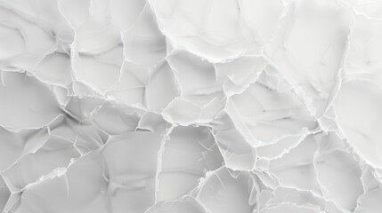 Fototapeta premium The image is a close up of a white surface with a lot of cracks and holes