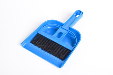 Small blue broom and dustpan set isolated on white background