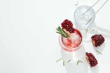 Cocktail with fresh pomegranate on a white background