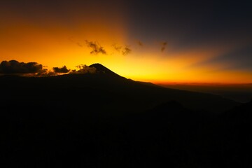 Scenic view of Mount Agung (the highest point on Bali, 3031 m) taken at sunset from the Lahangan Sweet viewpoint located in east Bali (Kecamatan Abang Subdistrict, Karangasem Regency, Bali, Indonesia)