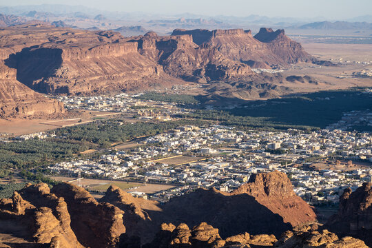 Al Ula, Saudi Arabia: Dramatic panoramic view of the Al Ula landscape famous for its red desert and rock formations and heritage sites in Saudi Arabia from the top of Mt Harrat