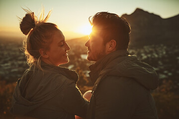 Couple, sunset and mountain for travel in outdoor, talking and together on vacation. People, nature and support for freedom on holiday, conversation and romance on cliff for love in relationship