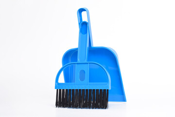 Small blue broom and dustpan set isolated on white background