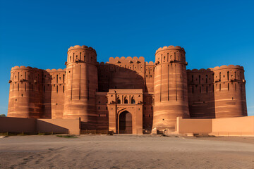 The Impressive Fortress: An Awe-inspiring View of a Timeless Citadel against a Blue Sky