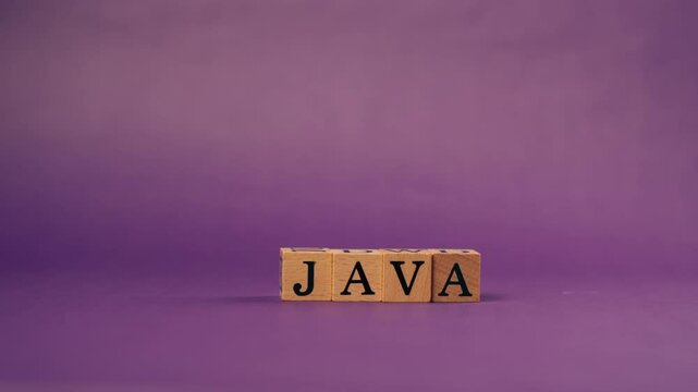 purple warm background with shadows wooden cubes with black letters and laid out words from letters java