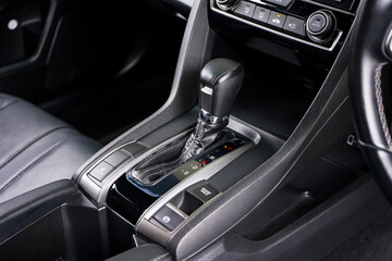 automatic transmission shift selector in the car interior. Closeup a manual shift of modern car gear shifter. 4x4 gear shift 