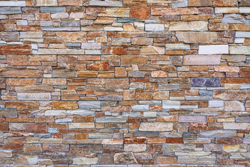 Colorful and textured stone brick wall - abstract graphic background