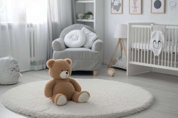 Plush toy pillow white round carpet grey armchair posters on wall in baby s room