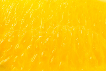 Macro detail photo of Yellow colored citrus sinensis pulp texture. Empty blank copy text space