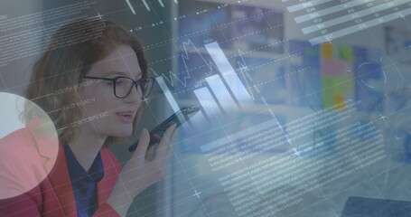 Image of statistical data processing against caucasian woman talking on smartphone at office