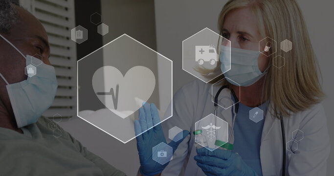 Image of digital icons data processing over caucasian female doctor in face mask vaccinating