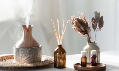 Spa composition with incense sticks, air humidifier and aroma oils.