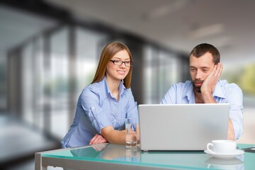 Two busy business colleagues working together