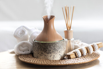Essential oil aroma diffuser humidifier diffusing water articles in the air.