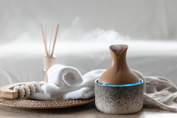 Essential oil aroma diffuser humidifier diffusing water articles in the air.