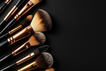 Various professional makeup brushes isolated on black background Cosmetics concept with copy space