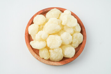 Geblek is a traditional food specialty from the regions of Kulon Progo, Purworejo Regency, and Wonosobo Regency, made from tapioca flour and fried with onion seasoning. Isolated on white background.