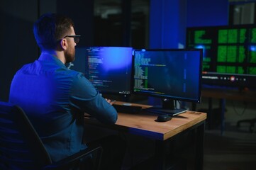 programmer working at desk in office