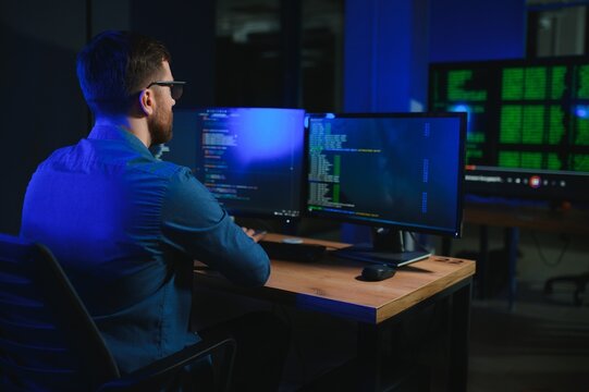 programmer working at desk in office