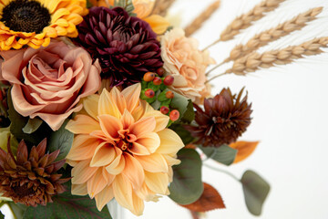 
Autumn wedding bouquet, blending peach roses, plum dahlias, and mustard yellow sunflowers, with hints of dried wheat, isolated white background, leave plentiful space.