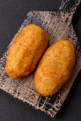 Delicious chicken Kiev or potato cutlets with salt, spices and herbs
