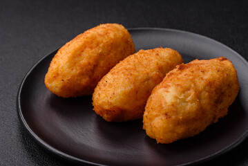 Delicious chicken Kiev or potato cutlets with salt, spices and herbs