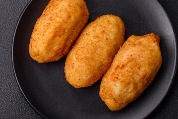Delicious chicken Kiev or potato cutlets with salt, spices and herbs