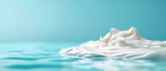  A close-up of a blue and white checkered background with a milky splash in the foreground