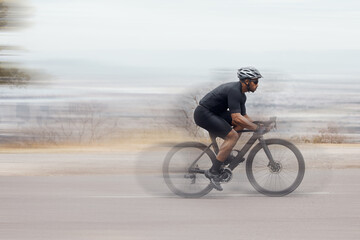 Man, fitness and speed with cyclist on mountain bike in workout, exercise or outdoor cardio. Active...